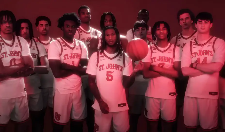 The St. John's basketball players, in their white uniforms