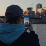 Man filming New York City on his phone