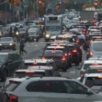 A New York street, choked with vehicles, creating a standstill