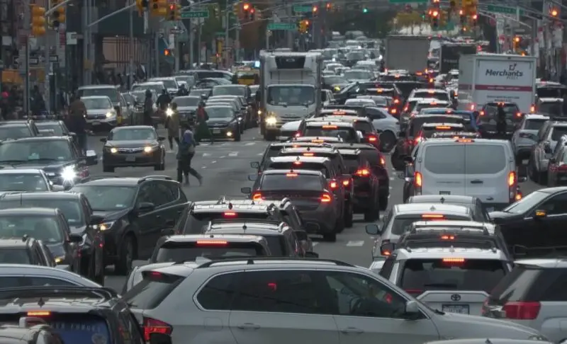A New York street, choked with vehicles, creating a standstill