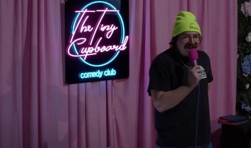 Comedian performing at The Tiny Cupboard Comedy Club