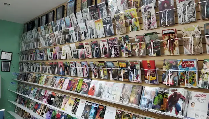 A vibrant wall displaying a diverse collection of comic books and graphic novels