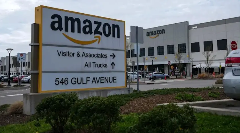 Amazon fulfillment center entrance at 546 Gulf Avenue in Staten Island, with a large sign directing visitors and trucks