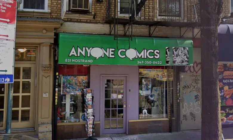 Anyone Comics storefront at the corner of a street, featuring colorful signage and a welcoming entrance