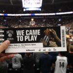 We Came to Play" text against a backdrop of a crowded basketball arena